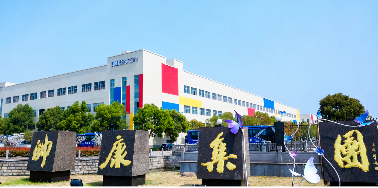 Building with colorful flags and statues in front on a clear day